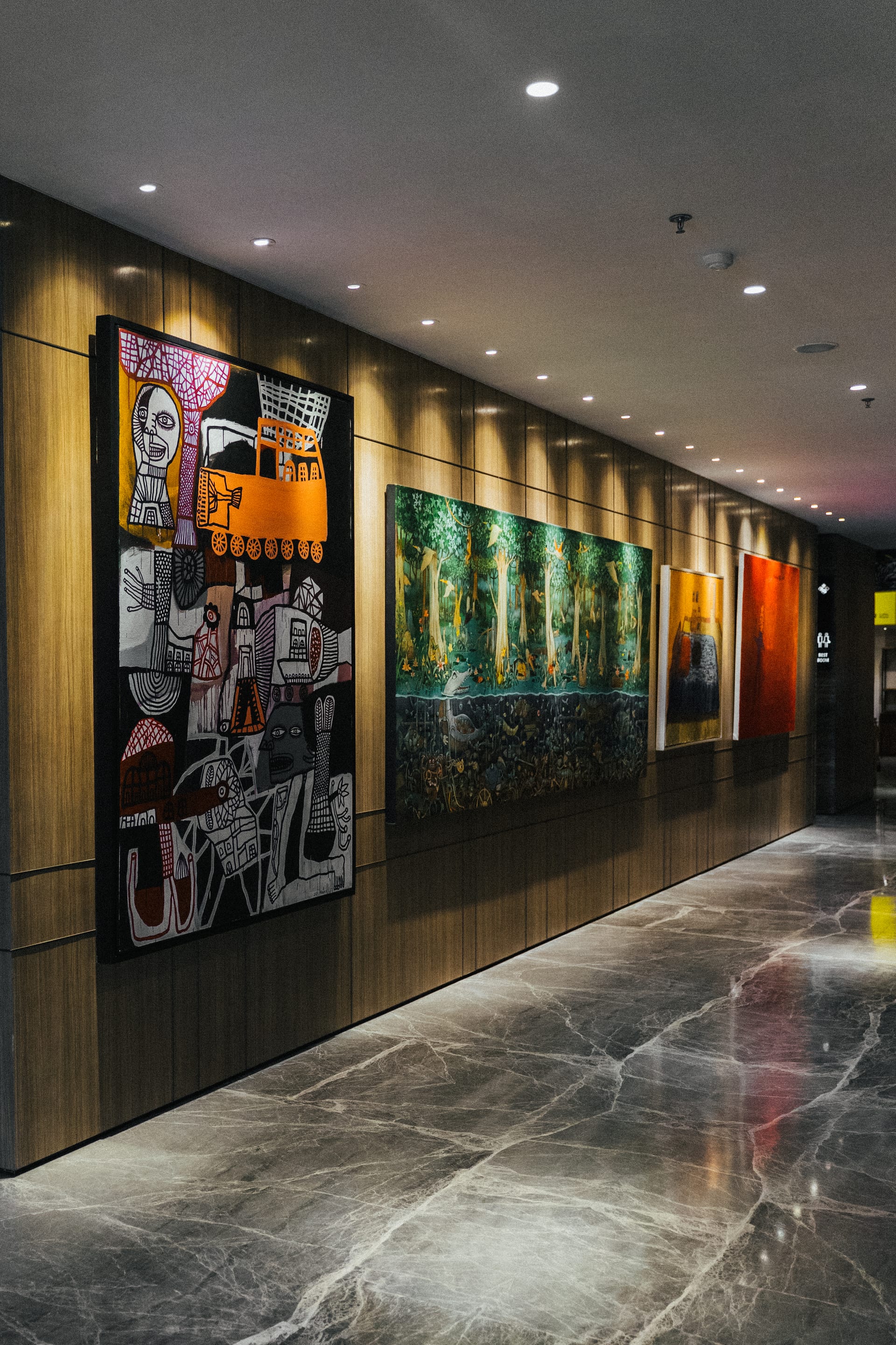 Multiple artworks displayed in the PULANG ke UTTARA lobby